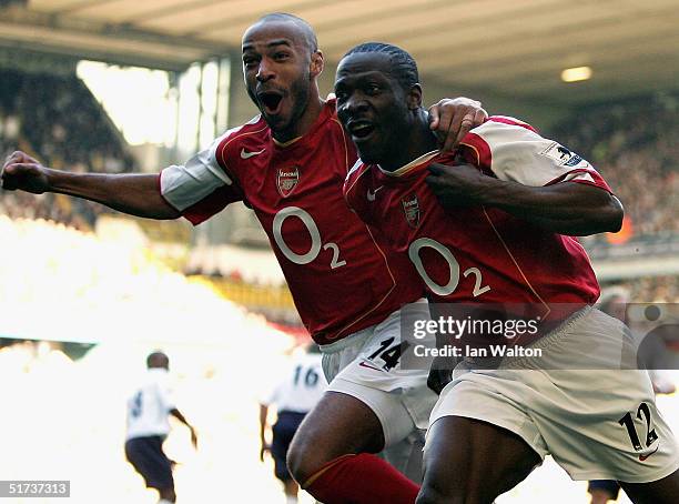Lauren of Arsenal celebrates with Thierry Henry during the Barclays Premiership match between Tottenham Hotspur and Arsenal at White Hart Lane on...