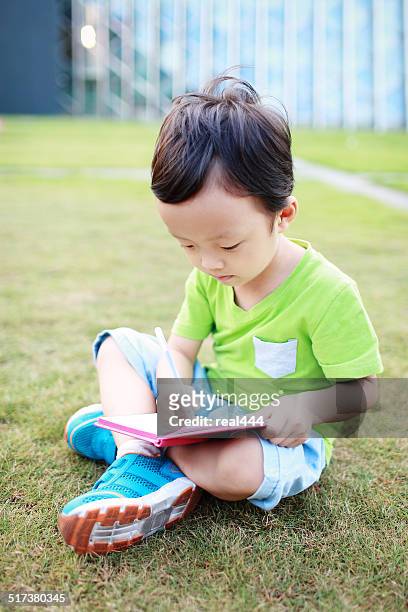 the children in the library - one boy only stock pictures, royalty-free photos & images