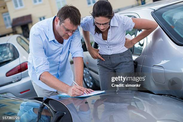 drivers fill out an accident report - car accident report stock pictures, royalty-free photos & images