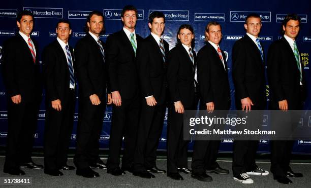 Competitors for the singles title pose for photographers before the Tennis Masters Cup November 13, 2004 at the Westside Tennis Club in Houston,...