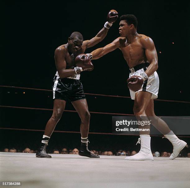 Doug Jones takes a right punch from Cassius Clay during their bout at Madison Square Garden. Clay defeated Jones in the 10-round match.