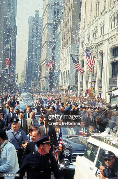 Apollo 11 astronauts wave from open car after City Hall ceremonies here. Left to right: Michael Collins, Buzz Aldrin and Neil Armstrong. In front of...