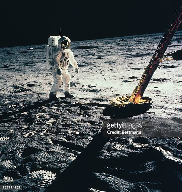 Tranquility Base, The Moon: Astronaut Buzz Aldrin, lunar module pilot, prepares to deploy the early Apollo Scientific Experiments Package during the...