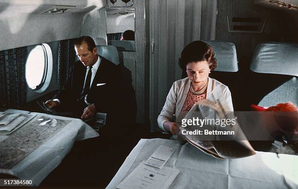 Queen Elizabeth II and Prince Philip fly back from a visit to Yorkshire in an Andover of the Queen's Flight, in a photo taken during the filming of...