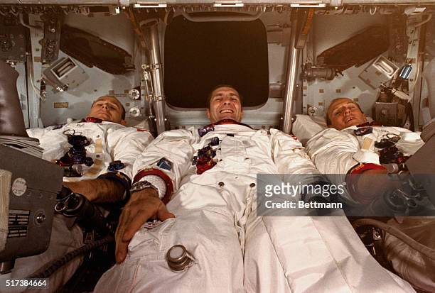 Cape Kennedy, Florida: Apollo 12 astronauts lie inside the command module during preparations for the November 14th blastoff. Left to right: Alan...