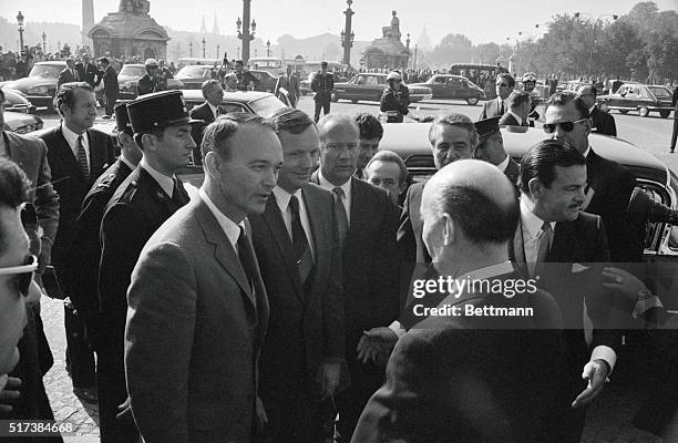 Astronuats in Paris. Paris: U.S. Astronauts Michael Collins, Neil Armstrong and Buzz Aldrin enter their hotel near the Place de Concorde after...