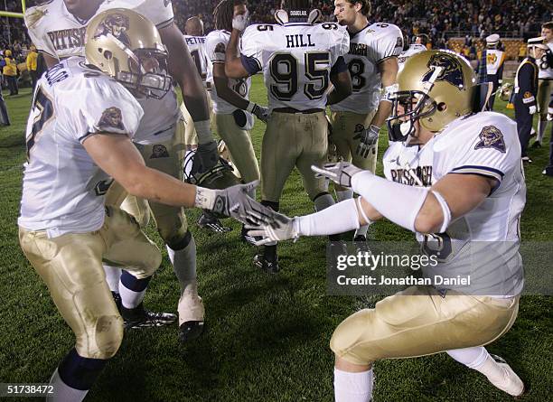 Fullback Chris McKillop and defensive back Doug Roseberry of Pittsburgh celebrate a last-second win over Notre Dame after a game on November 13, 2004...