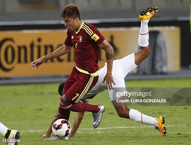Venezuela's Adalberto Penaranda drives the ball during the Russia 2018 FIFA World Cup South American Qualifiers' football match against Peru, in Lima...