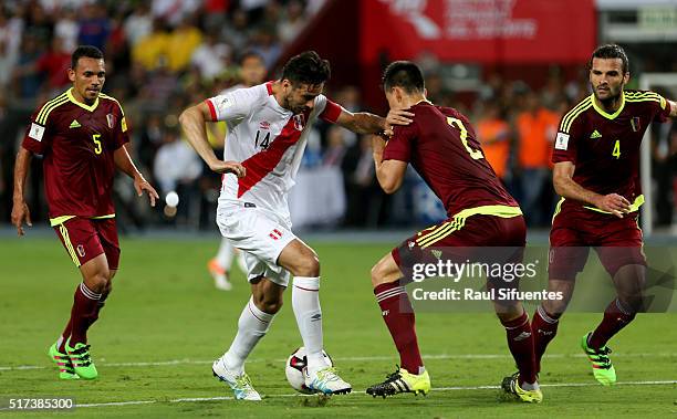 Claudio Pizarro of Peru struggles for the ball with Wilker Angel of Venezuela during a match between Peru and Venezuela as part of FIFA 2018 World...