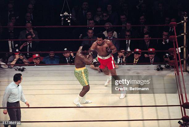 Muhammad Ali lands a right to the head of heavyweight champion Joe Frazier during their title bout at Madison Square Garden. Frazier became the...