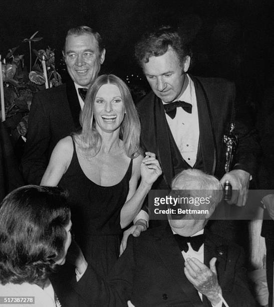 Hollywood, California: Academy Award winners celebrating after the awards are Ben Johnson, Gene Hackman, Cloris Leachman and Charlie Chaplin.
