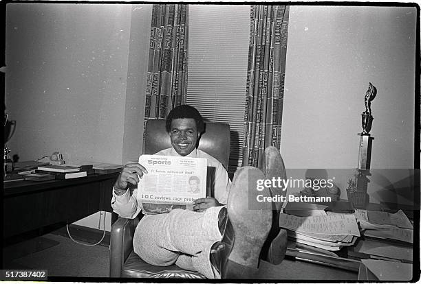 Chicago Bears' running back Gale Sayers, a Chicago Park District Commissioner, relaxes in his office 9/12 and reads a newspaper which tells of his...