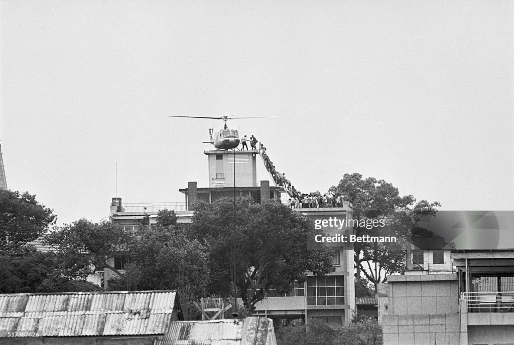 Helicopter Evacuating Crowd from Rooftop