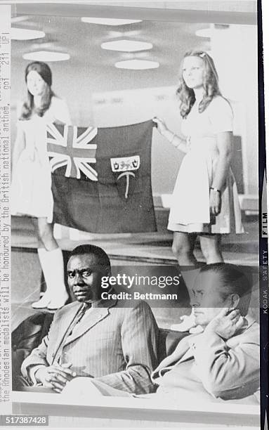 Jean Claude Ganga, of Zaire, the Secretary General of Supreme African Sports Council, and Willie Daume, President of Olympic Organizing Committee,...