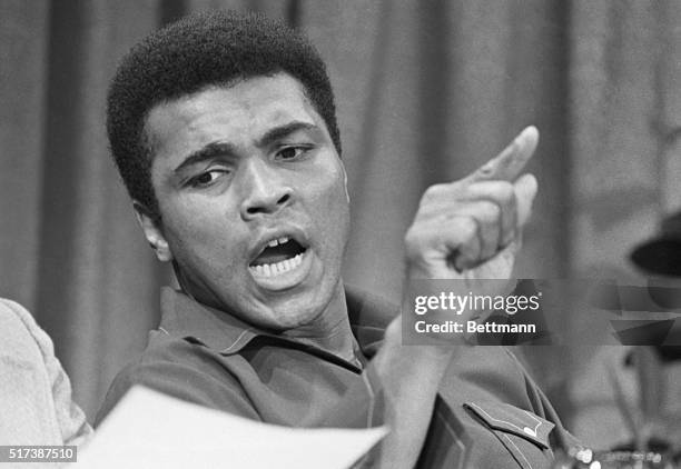 Former heavyweight champion Muhammed Ali stresses a point during a press conference at which it was announced that he would fight two 5-round...