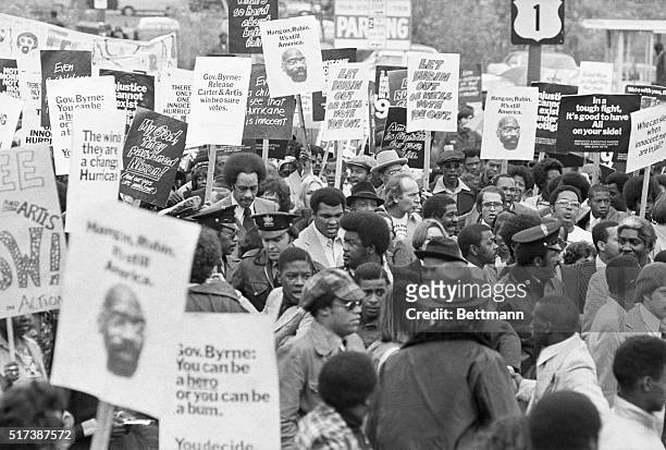World heavyweight champ Muhammad Ali leads a rally of some 1,000 persons through streets of Trenton here, to urge New Jersey Governor Brendan Byrne...