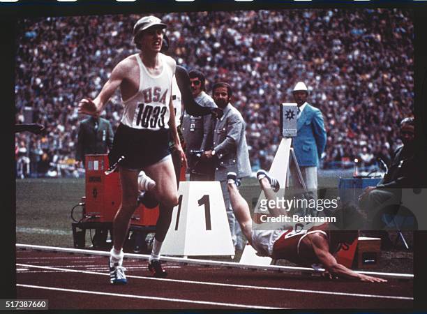 Dramatic finish in 800m men's final - Soviet Union's Evgeni Arzhanov is seen falling at the finish line after leading the final. At the left is David...