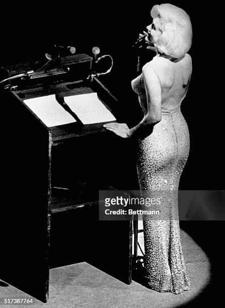 Actress Marilyn Monroe sings "Happy Birthday" to President John F. Kennedy at Madison Square Garden, for his upcoming 45th birthday.