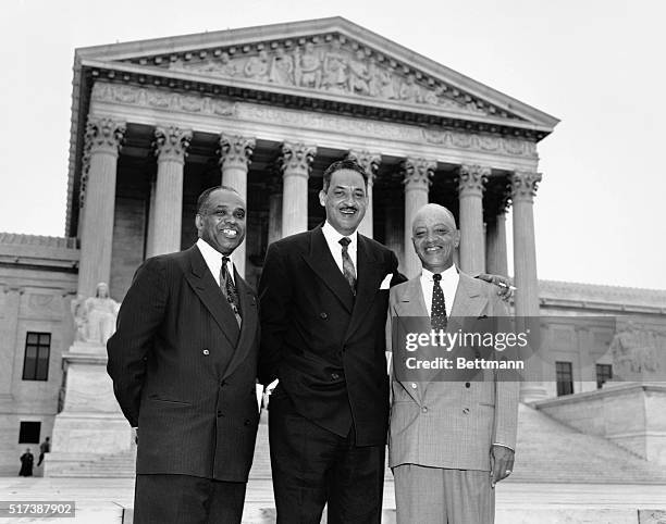 Washington, DC: Attorneys who argued the case against segregation stand together smiling in front of the U.S. Supreme Court Building after the High...