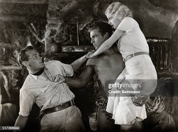 Movie Still: Edward Woods, Buster Crabbe and Jacqueline Wells in a scene from "Tarzan The Fearless", Released 1933. Sol Lesser presents Buster Crabbe...