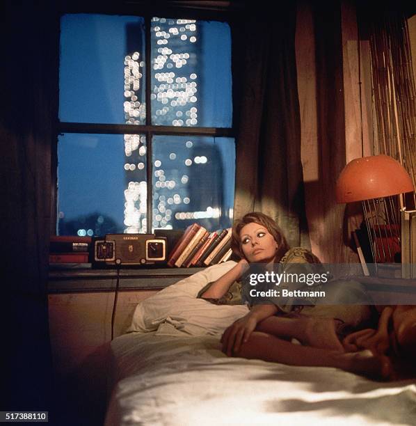 Italian actress Sophia Loren in a publicity still, set in a New York apartment at night, for 'Lady Liberty', directed by Mario Monicelli, 1971.