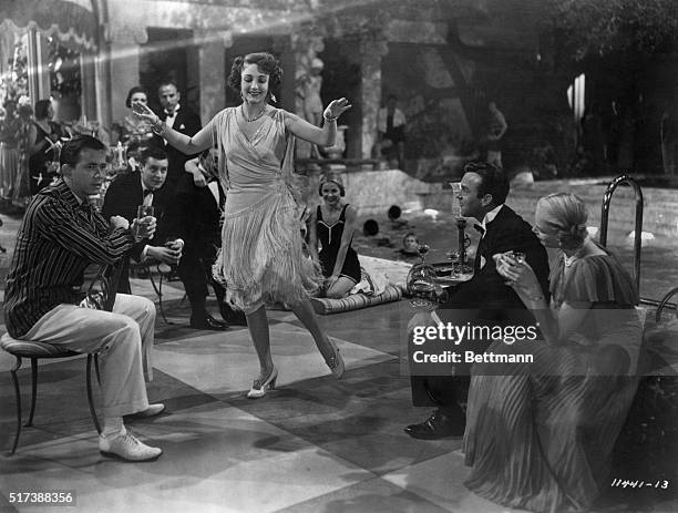 Actress Betty Field dances the Charleston during a poolside party scene from the 1949 movie The Great Gatsby.