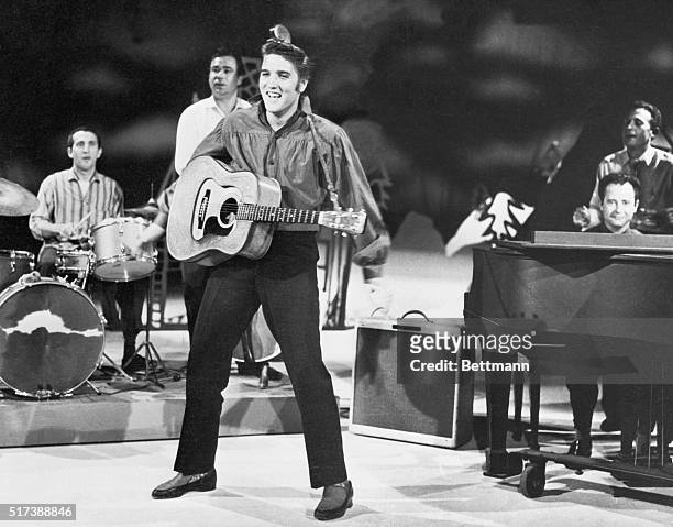 New York, NY: Elvis Presley, rock and roll sensation, as he rehearses with his band for "The Ed Sullivan Show."