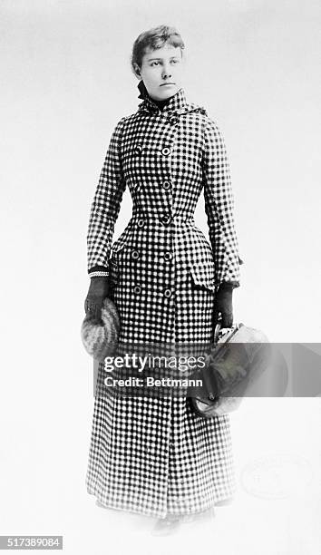 Journalist Nellie Bly with a traveling bag. Photograph, 1890.