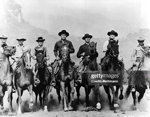 Movie still from The Magnificent Seven features the seven principal characters on horseback. The actors and their characters are : Steve McQueen as...