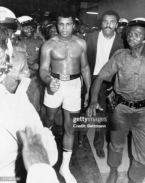 Heavyweight champion Muhammad Ali goes to his dressing room after defeating George Foreman for the world heavyweight title, known as the 'Rumble in...