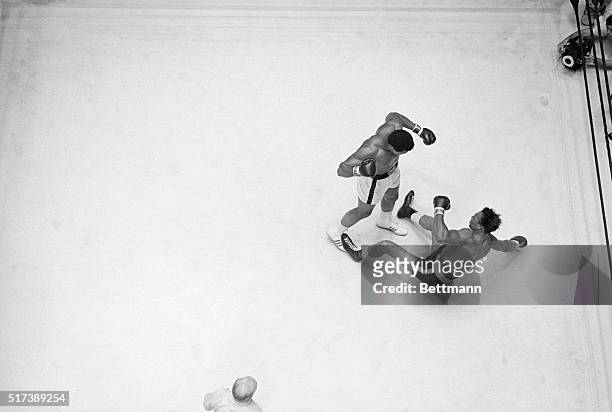 Houston, TX-: Heavyweight champion Cassius Clay knocks challenger Cleveland Williams to the canvas in the 3rd round of title fight in Houston's Dome...