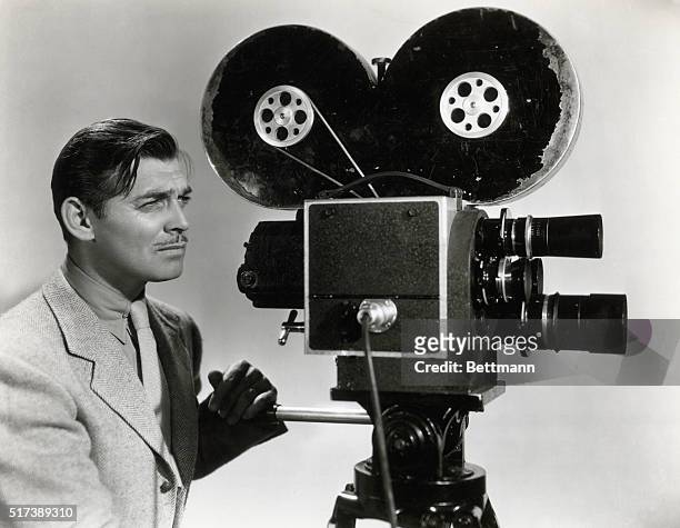 Clark Gable in a publicity photograph for his film Too Hot to Handle, 1938 in which he plays a newsreel reporter