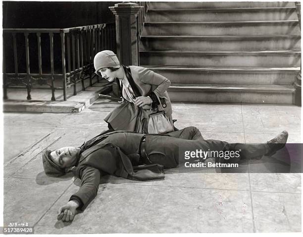 Norma Shearer and Lawrence Gray in a scene from Miss Shearer's new starring picture, "After Midnight," directed by Monta Bell. The actress is shown...