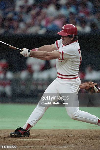 Action shot of Pete Rose, player-manager of the Cincinnati Reds, at bat in pursuit of Ty Cobb's all-time hit record.