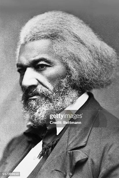 Portrait of American abolitionist and writer Frederick Douglass . He is shown in near profile, with gray hair and a beard. Undated photograph.