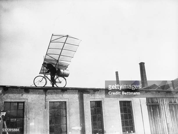 Berlin, Germany-Max Wiedenhoft, well-known German airplane designer, poises on the roof of one of the Tempelhof Aerodrome buildings, about to start a...