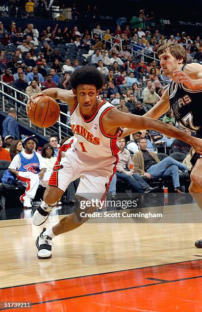 Josh Childress of the Atlanta Hawks drives against the San Antonio Spurs during NBA action on November 13, 2004 at Philips Arena in Atlanta, Georgia....