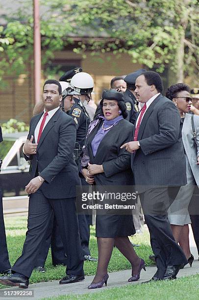 Atlanta, GA- Civil rights leader Coretta Scott King is escorted by her sons Dexter and Martin Luther King III into the West Hunter Street Baptist...