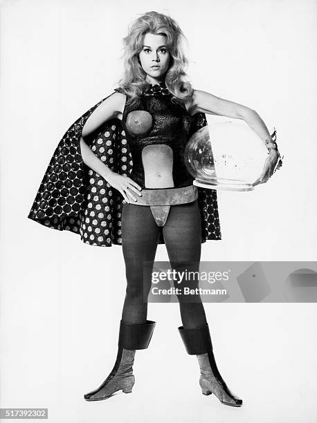 Publicity handout for the 1968 film "Barbarella," with Jane Fonda in tights, bodysuit , cape, boots and holding a plastic helmet.