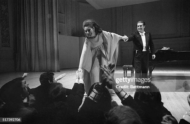 New York, NY- Soprano Maria Callas greets the audience after a concert in New York's Carnegie Hall. Singing a program of Italian and French operatic...