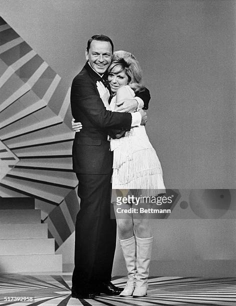 Picture shows legendary performer, Frank Sinatra, and his daughter, Nancy, embracing on the TV special, "The Man and His Music."