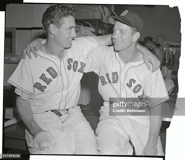 Ted Williams, , who drove in 6 runs and hit his 39th and 49th home runs, September 18th, celebrates his victory with pitcher Ellis Kinder, after the...