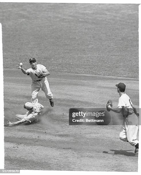 George Elder is out at second on Jerry Priddy's grounder that bounced off the glove of Allie Reynolds, the Yanks pitcher, in the first inning of...