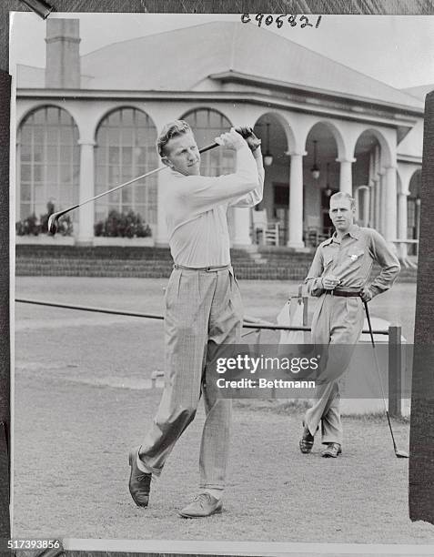 Donald Budge, of California, whose tennis is infallible, tries his hand at golf between matches in the annual North and South Professional Tennis...