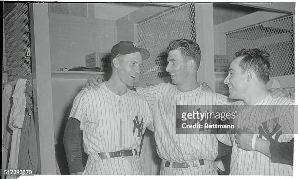 Yankees who played a big part in the 4-1 victory over the Detroit Tigers meet in the Yankee Stadium dressing room after the game, September 16. Left...