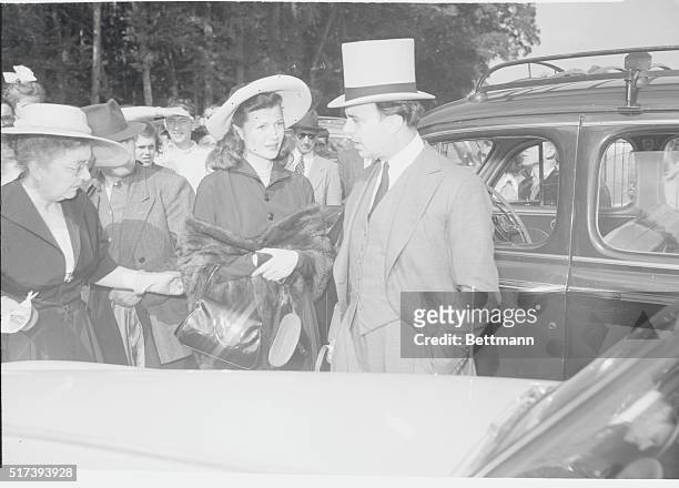 Newlyweds Prince Aly Khan and Rita Hayworth arrive at Chantilly Race Track for the "Prix du Jockey Club," top event of the Chantilly racing season....