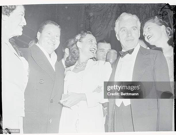Oakie Group. Stars Shine at Dictator Premiere. New York...Jack Oakie, Paulette Goddard and Charlie Chaplin, left to right, the Stars of Charlie's...