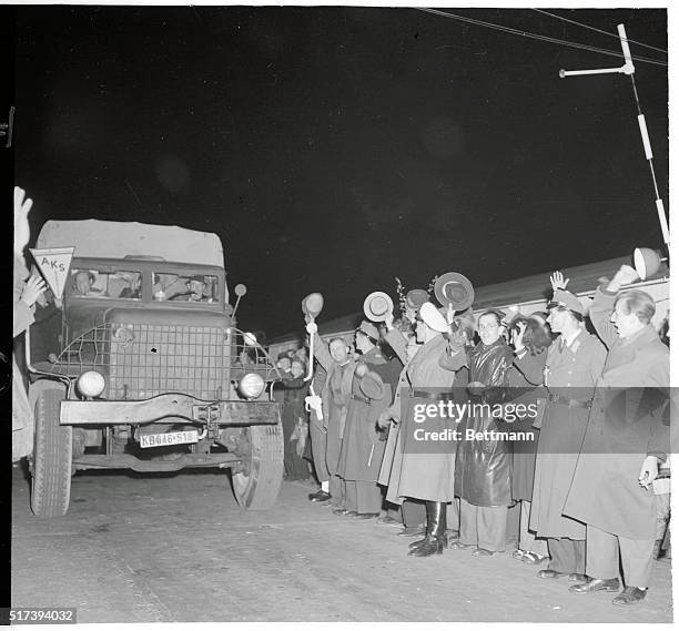 First After Blockade Lifting. Helmstedt: Crowd cheers as the first Allied freight truck departs for Berlin after barrier was lifted at...