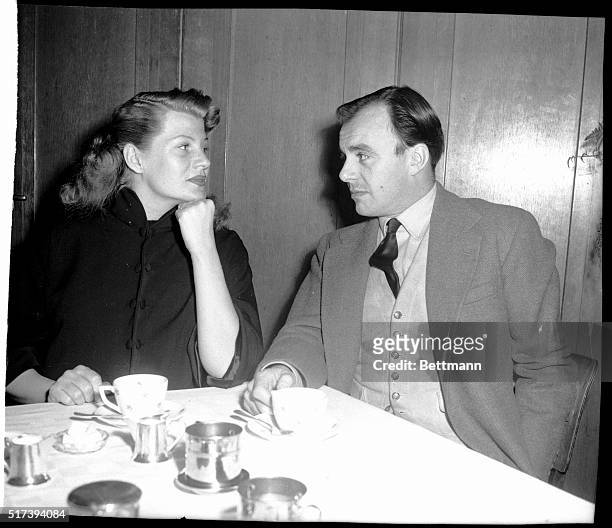 Aly Khan and his wife, actress Rita Hayworth, chat while taking lunch at "Rappaz" restaurant in Ouchy, near Lausanne. The stork is expected to join...