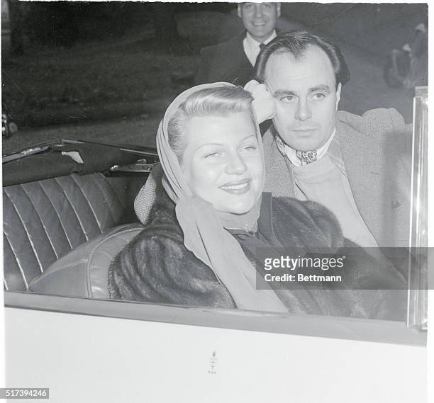 No Baby Until February. Lausanne, Switzerland: Actress Rita Hayworth and her husband, Prince Aly Khan, sit in her convertible outside the Chateau...